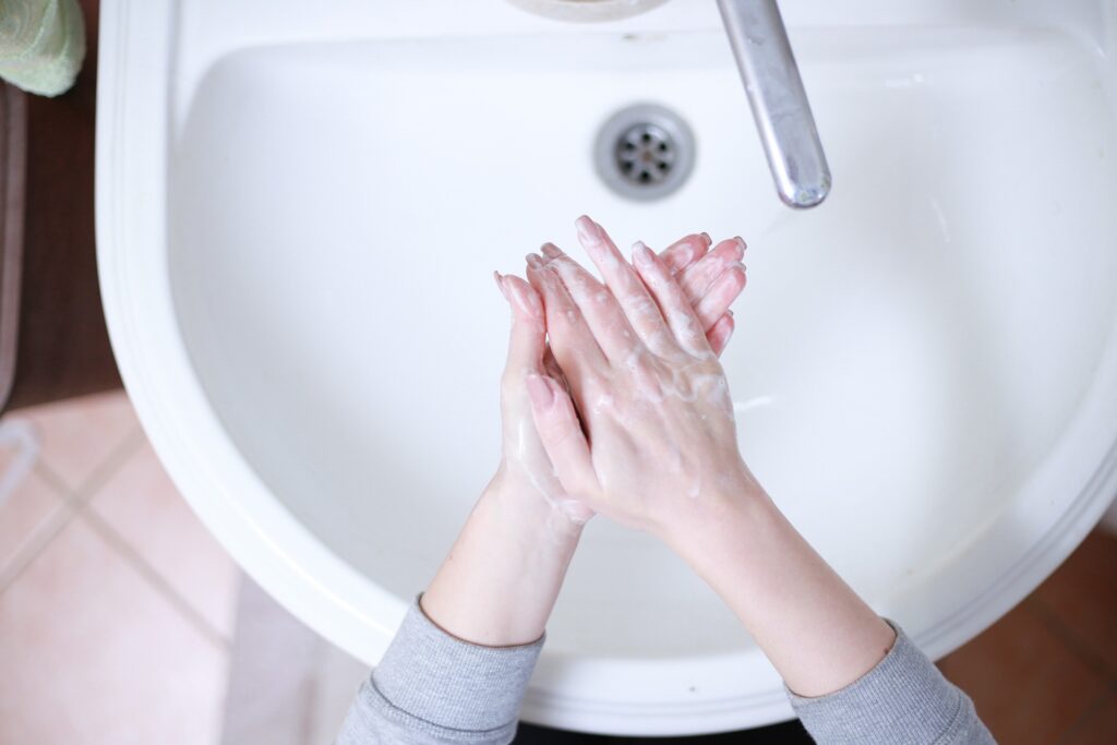 A person washing their hands