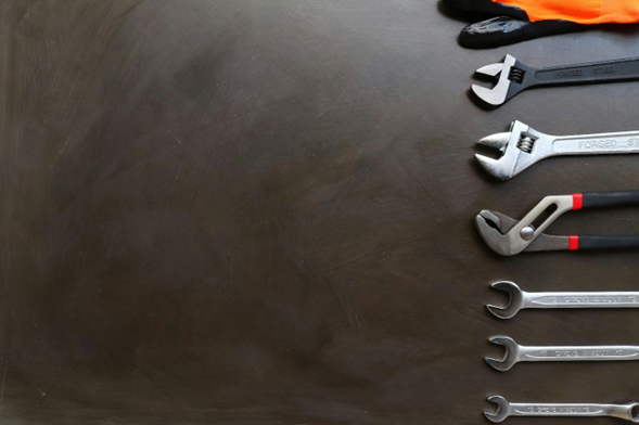 Plumbing tools and components organized on the floor for water system installation