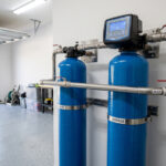 Whole house water filtration system installed in a Central Florida home garage.